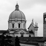 Timeless view of Brescia's classic architecture with prominent dome and tower.