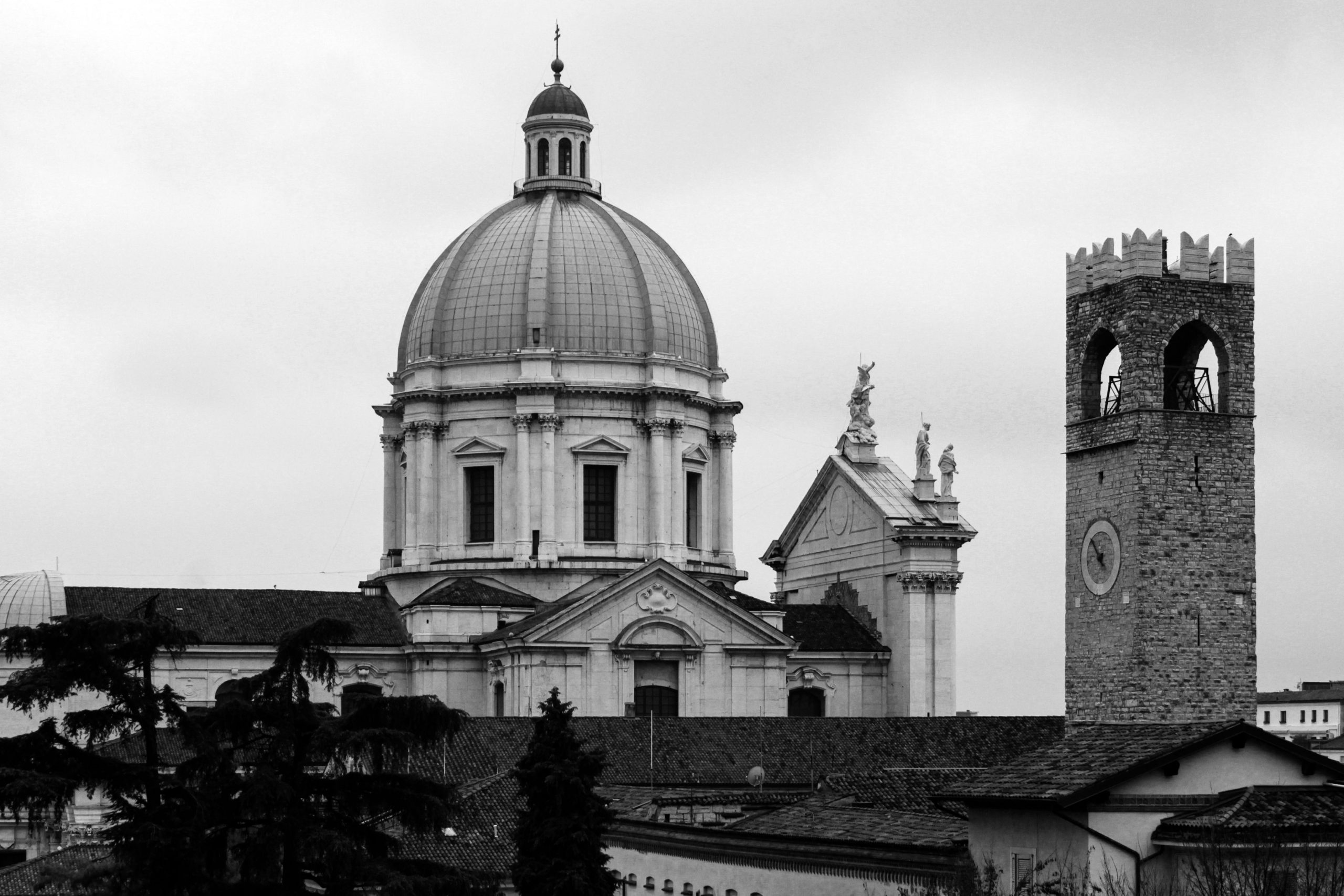 Timeless view of Brescia's classic architecture with prominent dome and tower.